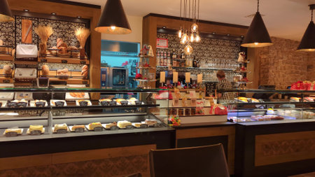 SARNEN, SWITZERLAND - DECEMBER 6, 2022. Small family patisserie and bakery interiorのeditorial素材