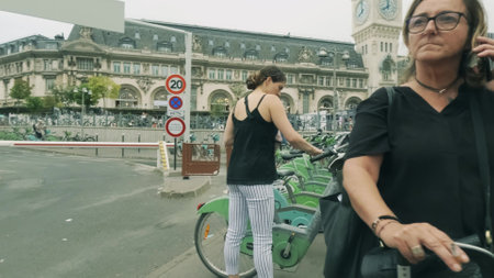 PARIS, FRANCE - JUNE 10, 2023. Tourists and city rental bikes at the Gare de Lyon railway stationのeditorial素材