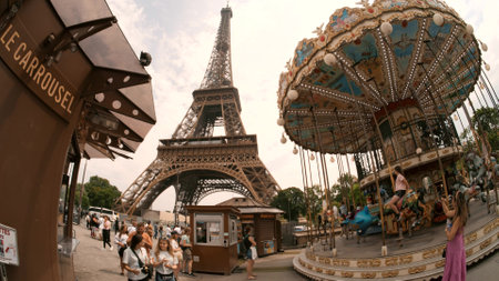 PARIS, FRANCE - JUNE 12, 2023. Artistic fisheye lens shot of the famous classic Carousel of the Eiffel Towerのeditorial素材