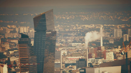 PARIS, FRANCE - JUNE 12, 2023. Tour BPCE Est, Groupe BPCE headquarters skyscraper behind citys heat hazeのeditorial素材