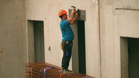 GRENOBLE, FRANCE - SEPTEMBER 20, 2023. A French construction worker at work