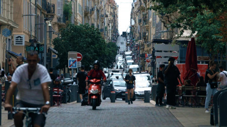 MARSEILLE, FRANCE - AUGUST 3, 2023. Busy narrow street traffic in the city centre of Marseille