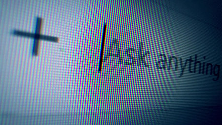 Macro of a computer screen showing a cursor and the text Ask anything. Concept of AI artificial intelligence, chatbots, and modern technologyの写真素材