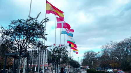 GRENOBLE, FRANCE - NOVEMBER 24, 2025. Flags of several EU countries waving along an urban streetのeditorial素材
