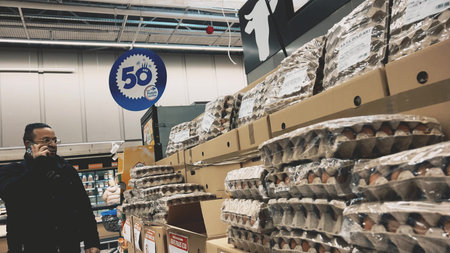 GRENOBLE, FRANCE - MARCH 10, 2026. Stacks of egg trays in Carrefour supermarket store