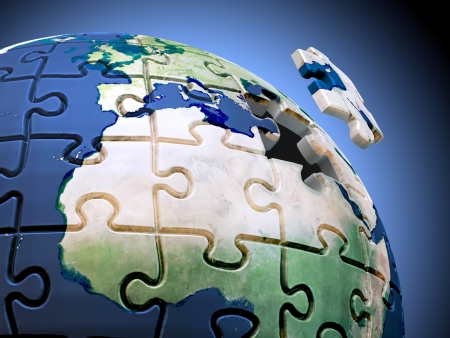 Last piece of the puzzle. A spherical jigsaw puzzle with the World mapの写真素材