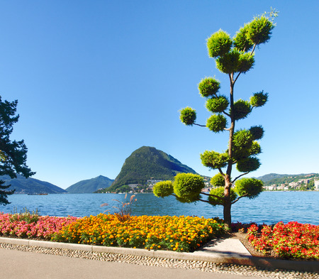 Lugano, Switzerland - Juli 31, 2014: Images of the Gulf of Lugano and Ciani park, botanical park of the city.のeditorial素材