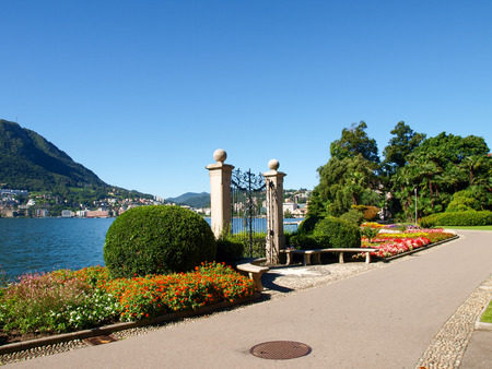 Lugano, Switzerland - Juli 31, 2014: Images of the Gulf of Lugano and Ciani park, botanical park of the city. The Gate at lake of Villa Ciani.のeditorial素材