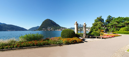 Lugano, Switzerland - Juli 31, 2014: Images of the Gulf of Lugano and Ciani park, botanical park of the city. The Gate at lake of Villa Ciani.のeditorial素材