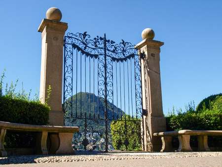 Lugano, Switzerland - Juli 31, 2014: Images of the Gulf of Lugano and Ciani park, botanical park of the city. The Gate at lake of Villa Ciani.のeditorial素材