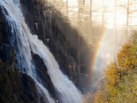 Dam of Contra Verzasca Ticino, Switzerland: spectacular waterfalls from the overflow of the lakeの写真素材