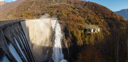 Dam of Contra Verzasca Ticino, Switzerland: spectacular waterfalls from the overflow of the lakeの写真素材