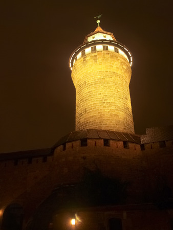 Nurenberg, Germany - December 10, 2014: Night view of ancient Tower of castle in the historic center illuminated at Christmas time.のeditorial素材