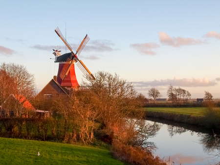 Greetsiel, Germany - December 6, 2014: Traditional Windmill working and still used to grind. The...