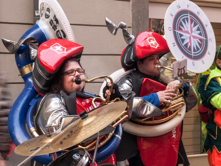 Lugano, Switzerland - february 12, 2015: Carnival Lugano Ul Sbroja, Guggenmusic Fracassband and Spacatimpan sounds in the town hall square and the streets in celebration.のeditorial素材