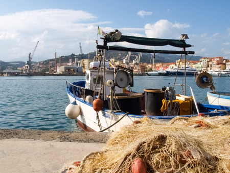 Oneglia, Italy - october 11, 2014: Marina and fishing. Several fishing boats are moored. In the background the buildings typical of Oneglia.のeditorial素材