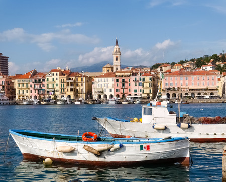 Oneglia, Italy - october 11, 2014: Marina and fishing. Several fishing boats are moored. In the background the buildings typical of Oneglia.のeditorial素材