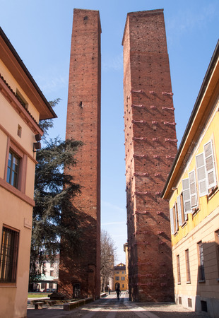 Pavia, Italy - March 8, 2015: Medieval towers in the historic center of the city. Especially the red brick used for the construction.のeditorial素材