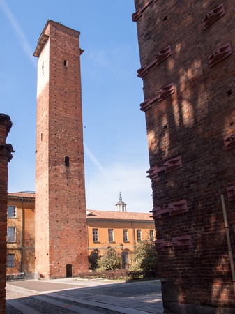 Pavia, Italy - March 8, 2015: Medieval towers in the historic center of the city. Especially the red brick used for the construction.のeditorial素材