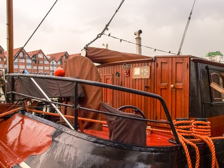 Leer, Germany - December 8, 2014: Ancient boats moored in the marina. The exposure to the public is free to visiting tourists.のeditorial素材
