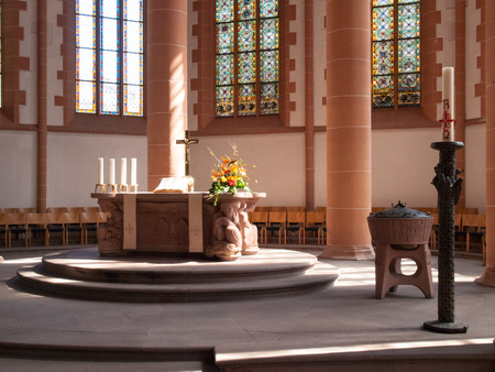 Heidelberg, Germany - April 20, 2015: HeiliggeistKirche, Altar illuminated by natural light coming from, a window on the side wall. The light creates a soft and delicateのeditorial素材