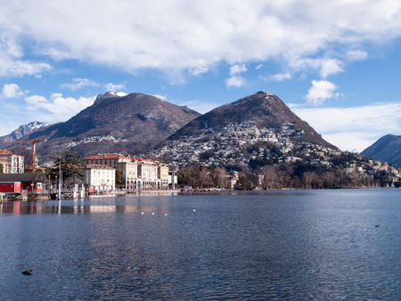 Lugano, Switzerland: Gulf of the lake and in the background Monte Bre snowyのeditorial素材