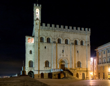 Italy, Gubbio - april 23, 2015: Evening pictures of the old town during a hot spring evening. The illuminations make partocolare the historic medieval villageのeditorial素材