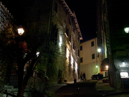 Italy, Gubbio - april 23, 2015: Evening pictures of the old town during a hot spring evening. The illuminations make partocolare the historic medieval villageのeditorial素材