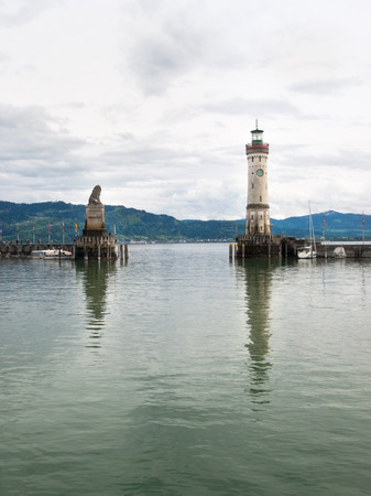 Lindau, Germany - May 2, 2015: Marina Lindau. Around the port several tourists relax in the cafs or stroll around the harbor.の写真素材