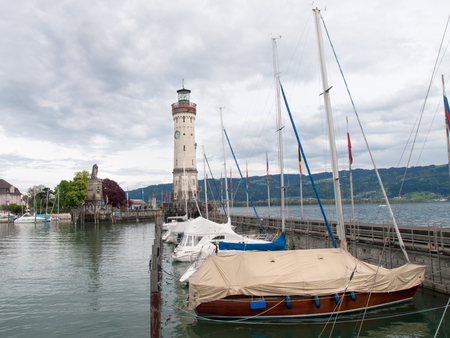 Lindau, Germany - May 2, 2015: Marina Lindau. Around the port several tourists relax in the cafÃ©s or stroll around the harbor.のeditorial素材
