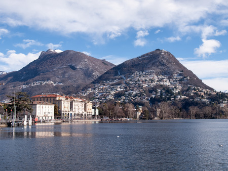 Lugano, Switzerland: Gulf of the lake and in the background Monte Bre snowyの写真素材