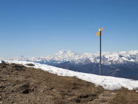 Montelema, Ticino - Switzerland: Signposts path. In the background the Monte Rosaのeditorial素材
