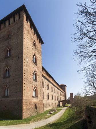 Pavia, Italy - March 8, 2015: Visconti Castle. Medieval building with red brick facades and a large garden mainsails. Steps under the arches make it protected from bad weather. The castle garden is used for summer shows.のeditorial素材