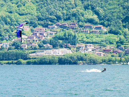 Pianello del ario, Italy - May 16, 2015: Kitesurfing action at the lake. Preparation, starting from the beach, sailing in the lake.のeditorial素材