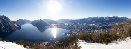 Winter landscape from Monte Bre. View of the village of Bre and the gulf of Luganoの写真素材