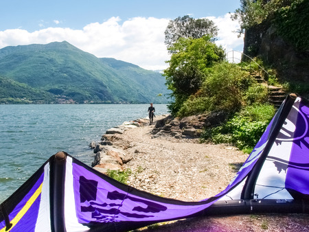 Pianello del Lario, Italy - May 16, 2015: Kitesurfing action at the lake. Preparation, starting from the beach, sailing in the lake.のeditorial素材