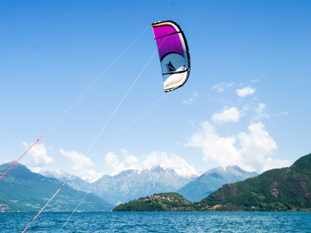 Pianello del Lario, Italy - May 16, 2015: Kitesurfing action at the lake. Preparation, starting from...