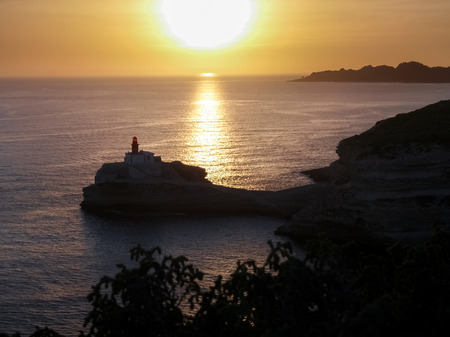 Corsica, France: Lighthouse of Bonifacio's Rock lit by the sunsetの写真素材