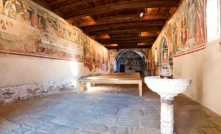 Sementina, Switzerland - december 9, 2016: Church of St. Bernard in the chestnut on Mornera. Ancient Romanesque church, in a tight angle but enriched with frescoes depicting the "Madonna del Latte".のeditorial素材
