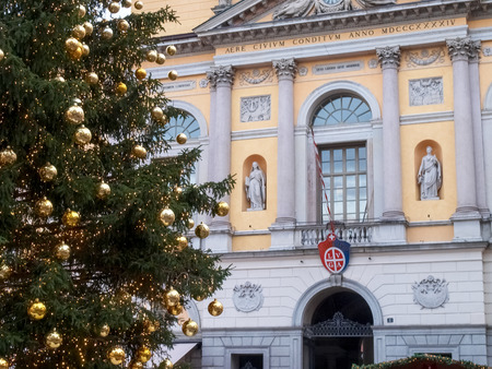 Lugano, Switzerland - December 18, 2016: Christmas market with huts lit and decorated with the colors at night.のeditorial素材