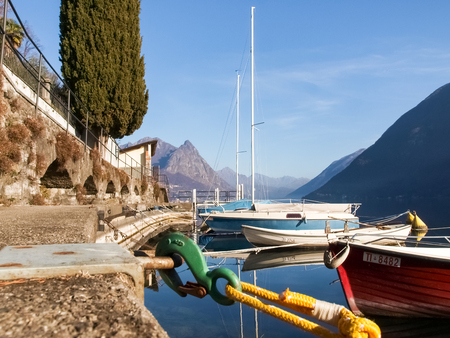 Lugano Gandria, Switzerland: Small boats moored along the shore of the small village on the lake of Luganoの写真素材