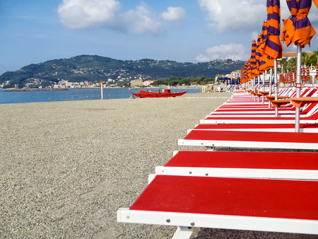 Diano Marina, Italy: Beach umbrellas positioned at regular fileの写真素材