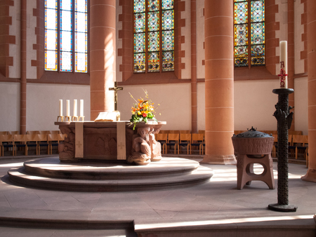 Heidelberg, Germany - April 20, 2015: HeiliggeistKirche, Altar illuminated by natural light coming from, a window on the side wall. The light creates a soft and delicateのeditorial素材