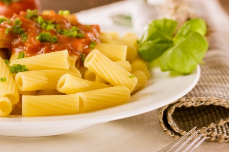 Fresh pasta with tomato sauce and basilの写真素材