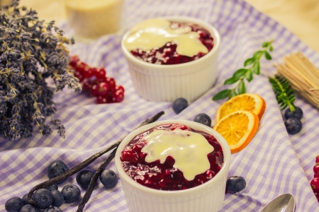 Red fruit compote with custardの写真素材