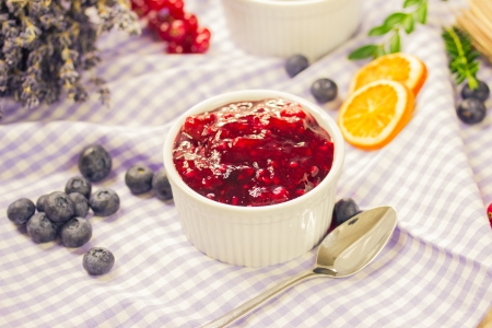 Red fruit compote with custardの写真素材