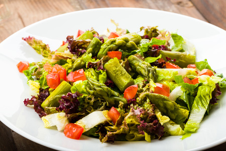 fresh asparagus salad with tomatoesの写真素材