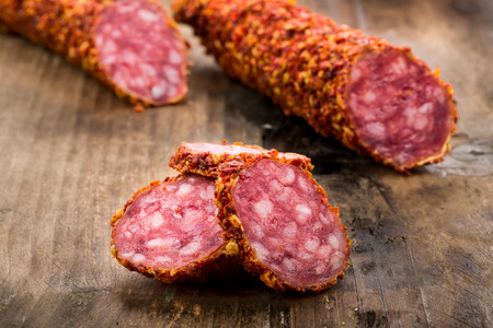 Fuet Salami on a wooden undergroundの写真素材