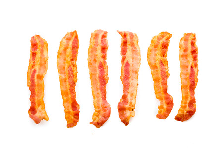 Freshly fried bacon served on white undergroundの写真素材