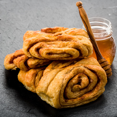 Cinnamon rolls flavored with fresh honey on undergroundの写真素材